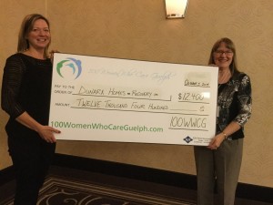 Dunara Homes for Recovery, our 5th winner! Michele Mactaggart (left), proud presenter on behalf of Dunara Homes, and Tannis Sprott of 100 WWCG (right) celebrate our newest winner.